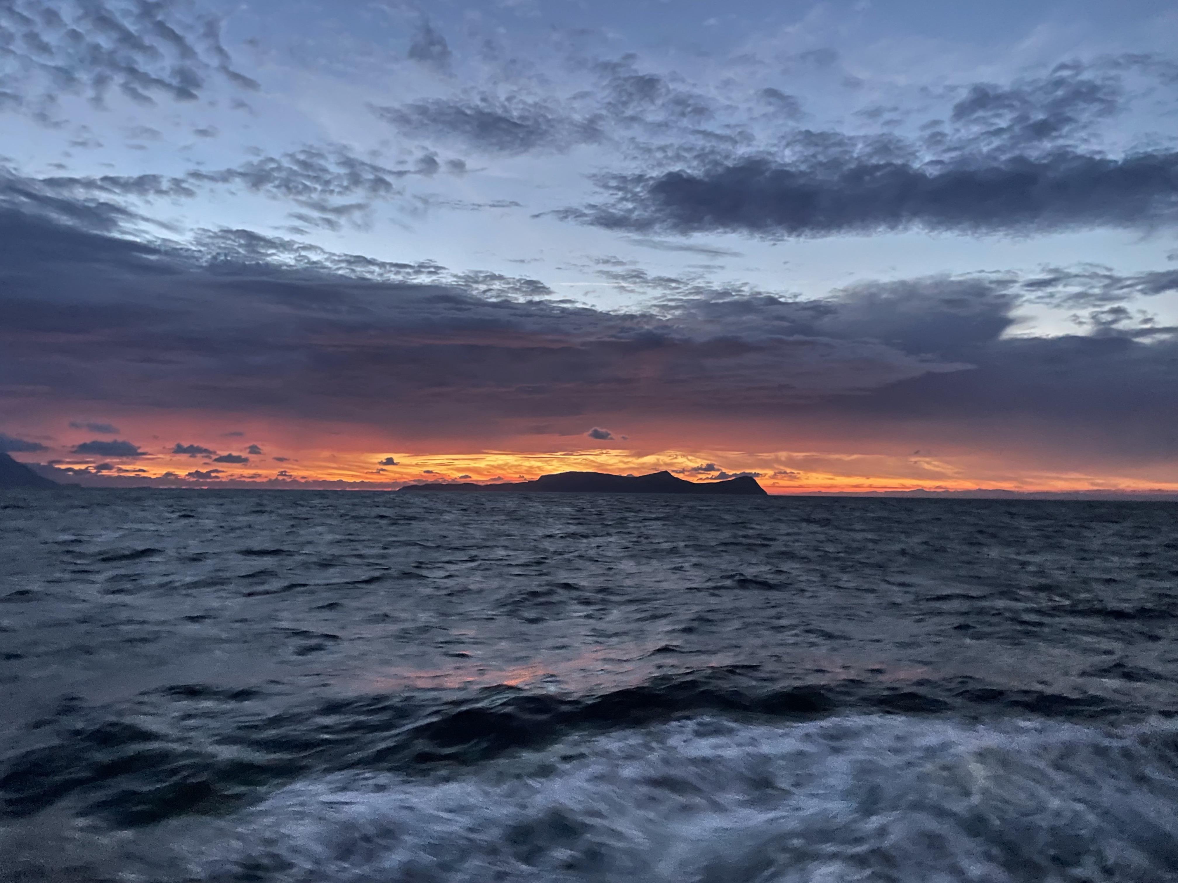 The Kuroshio flowing over seamounts and associated submesoscale flows drive 100-km-wide 100-1000-fold enhancement of turbulence
