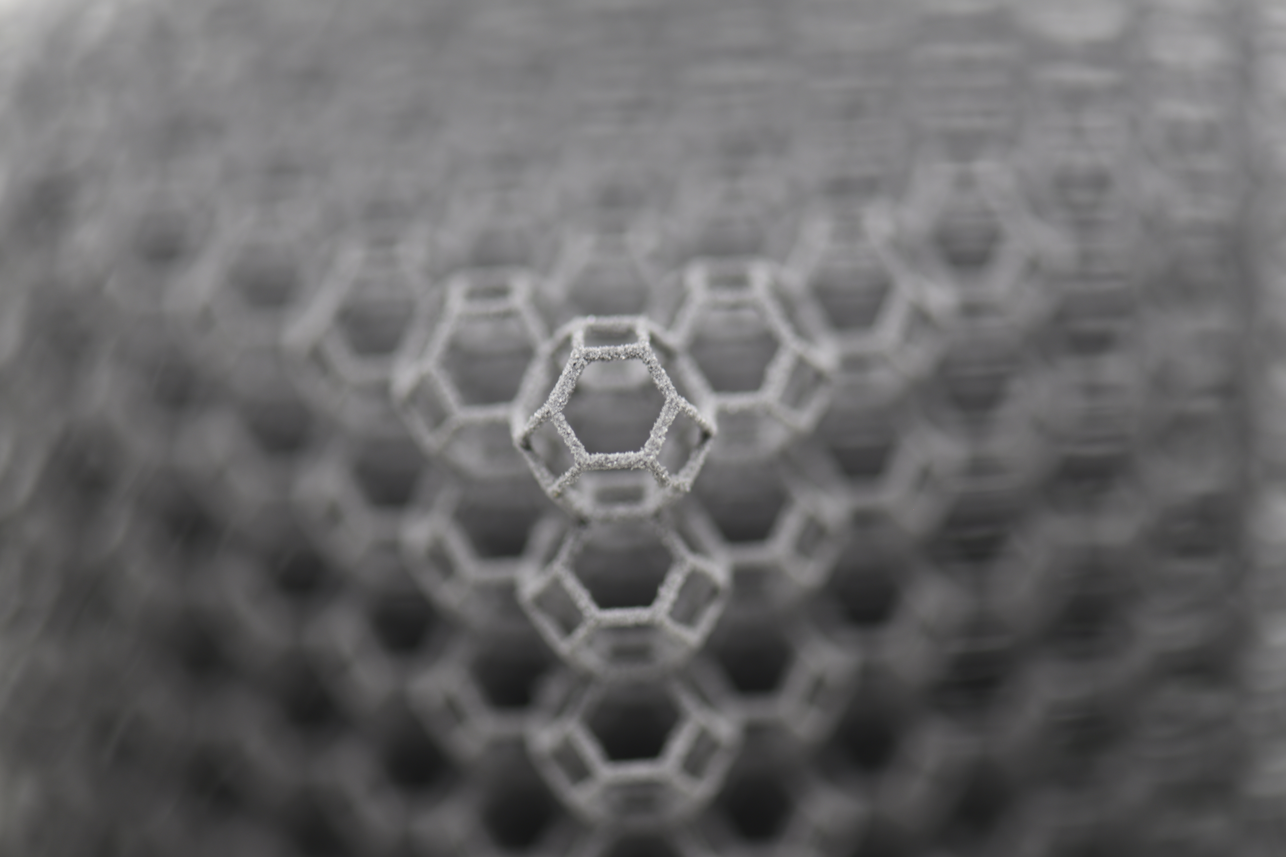 Predicting the unpredictable: generative design of truss metamaterials beyond boundaries